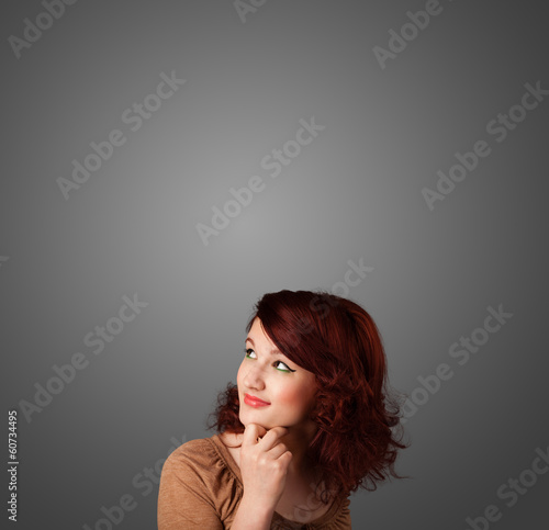 Thoughtful young woman gesturing with copy space