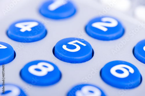 close up of a blue keypad