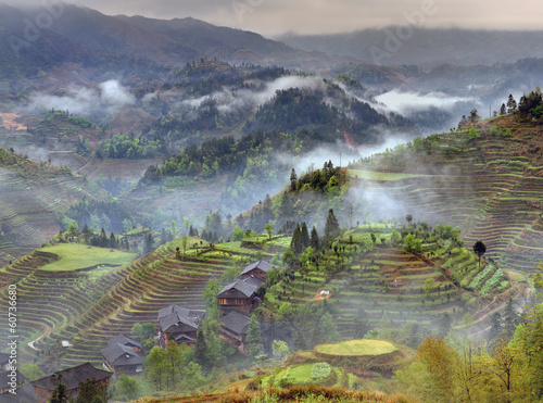 Spring landscape with village and rice terraces, mountain rural photo