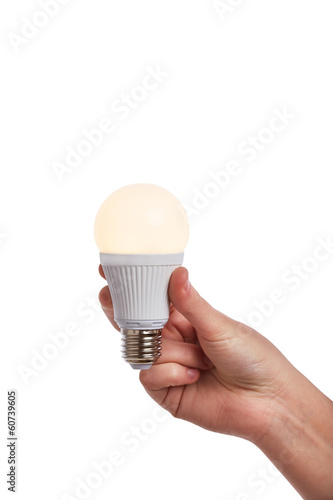 Hand holding bright led light bulb