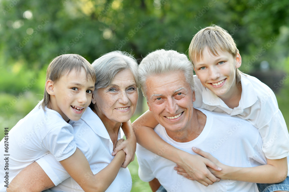 Older man and woman with their grandchildren Older man and woman with their grandchildren