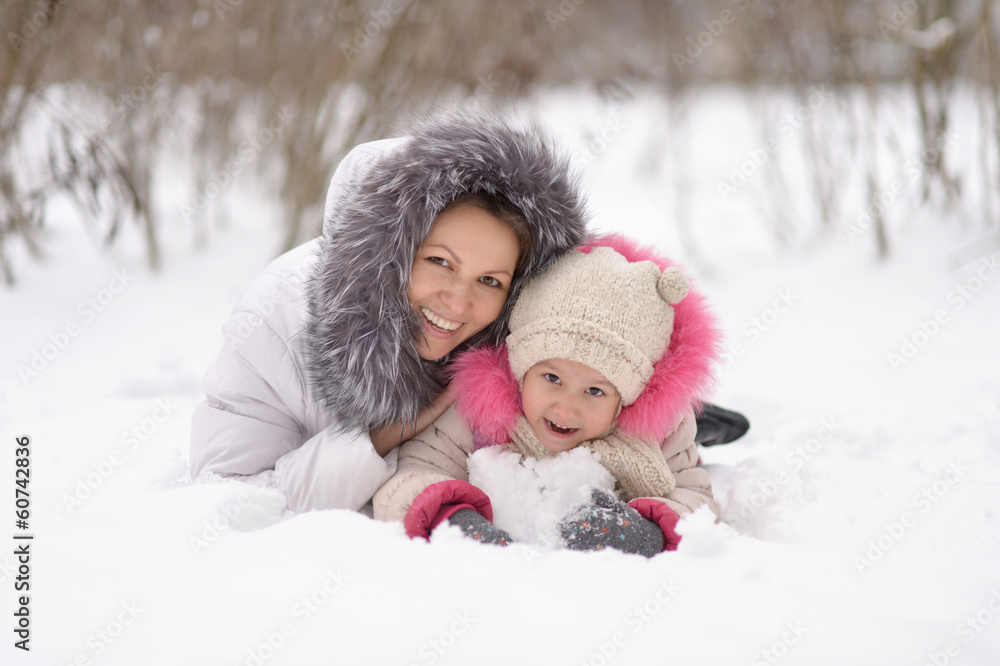 Mother and daughter in the snow. Mother and daughter in the snow.