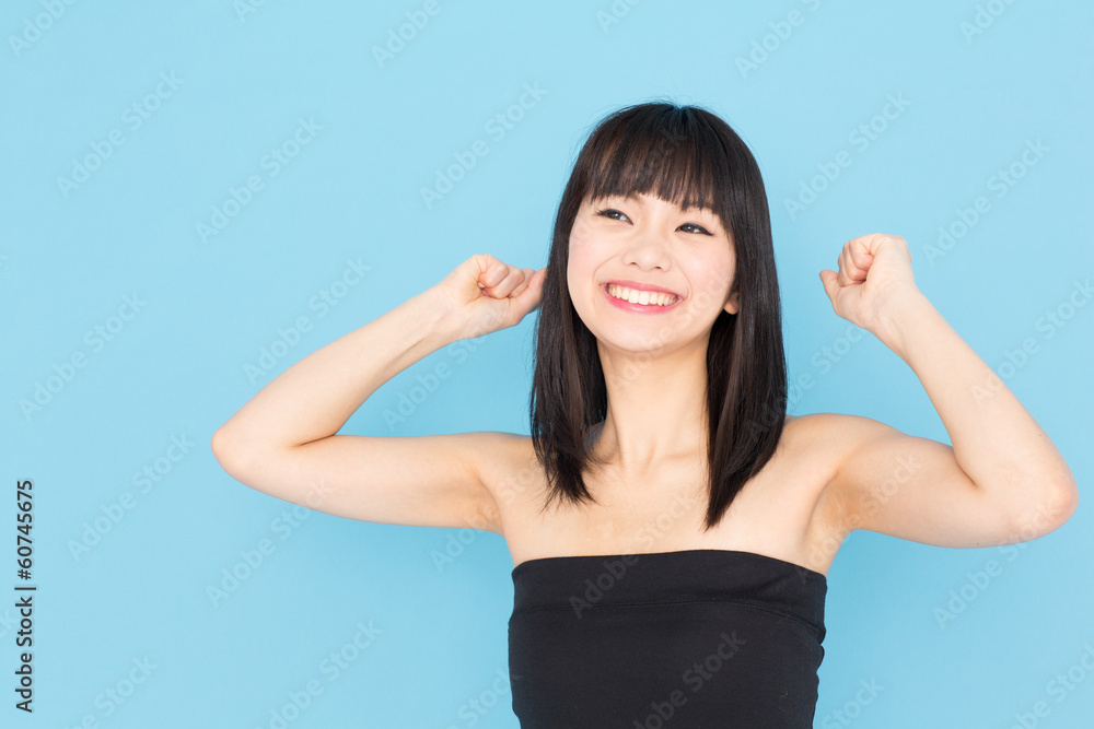 attractive asian woman on blue background attractive asian woman on blue background