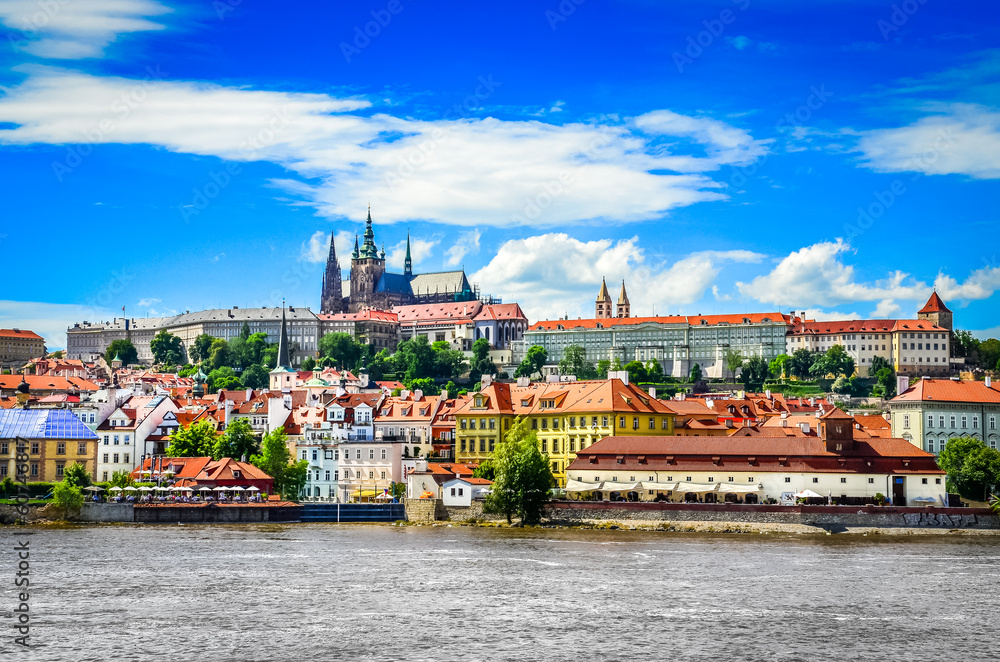 View of colorful old town and Prague castle with river