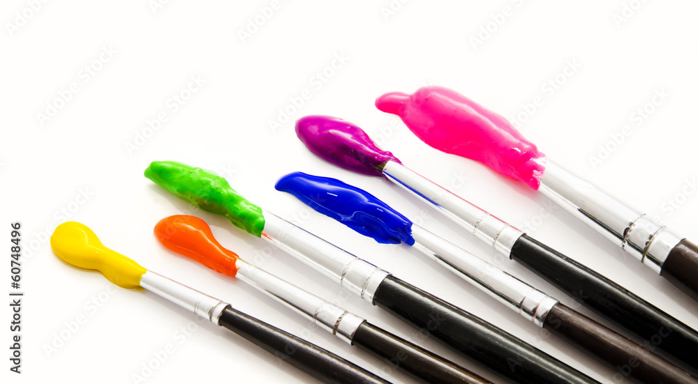 Six paint brushes with gouache isolated on white Six paint brushes with gouache isolated on white