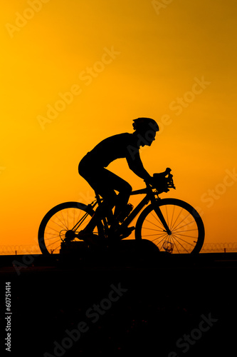 man biking on the road