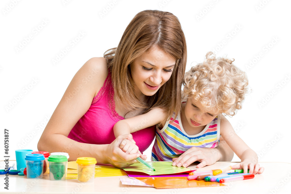 Mother and kid painting together Mother and kid painting together