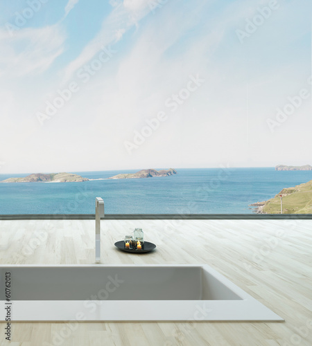 Fantastic floor bathtub against window with seascape view