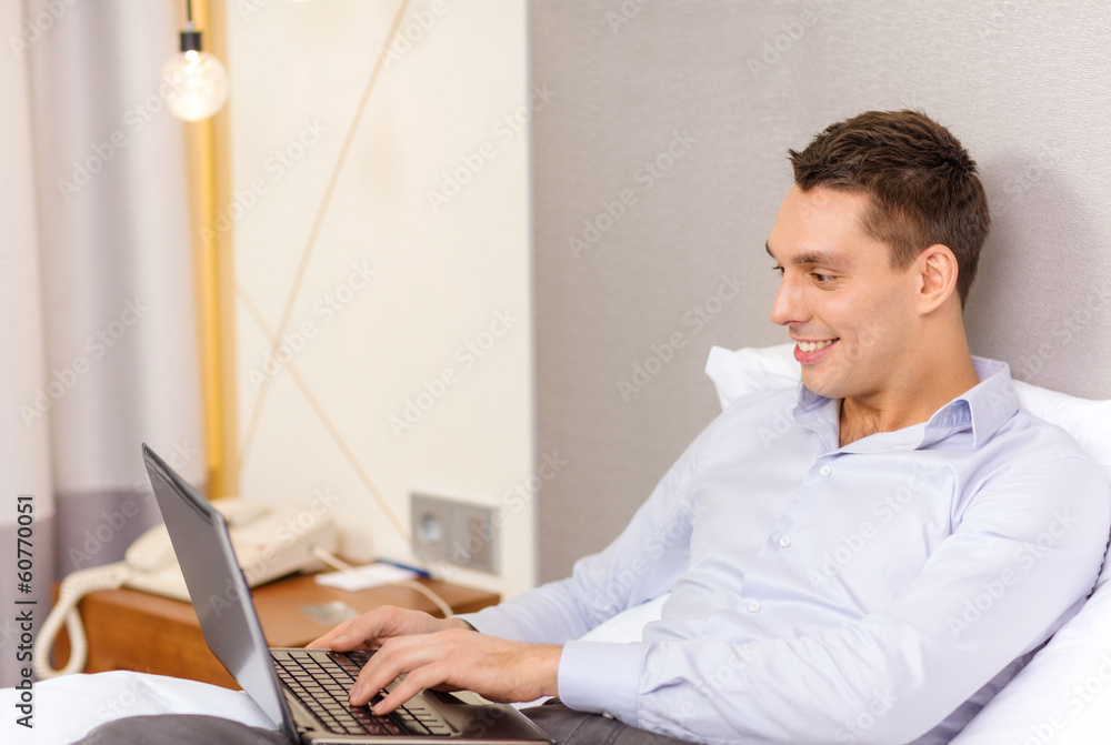 happy businesswoman with laptop in hotel room happy businesswoman with laptop in hotel room