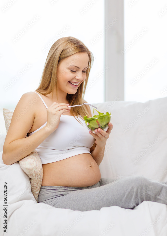 happy pregnant woman eating salad happy pregnant woman eating salad