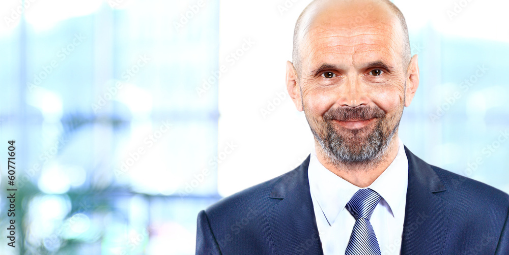 Happy mature business man looking at camera Happy mature business man looking at camera