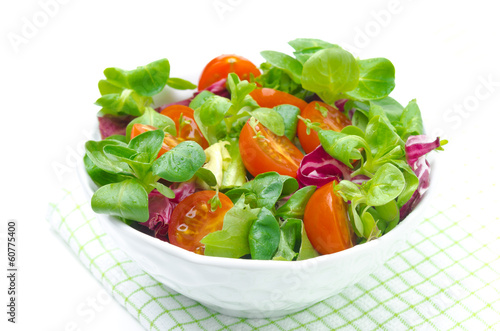 fresh salad and cherry tomatoes in a bowl, isolated