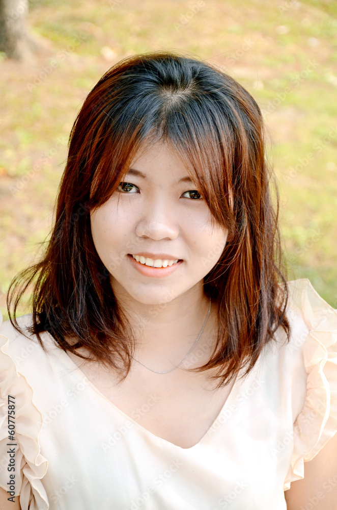 Portrait of smiling young beautiful Asian woman. Portrait of smiling young beautiful Asian woman.