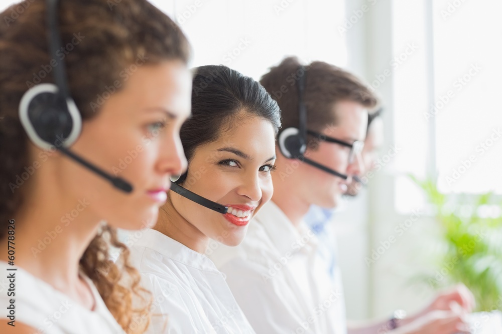 Smiling businesswoman working in call center Smiling businesswoman working in call center