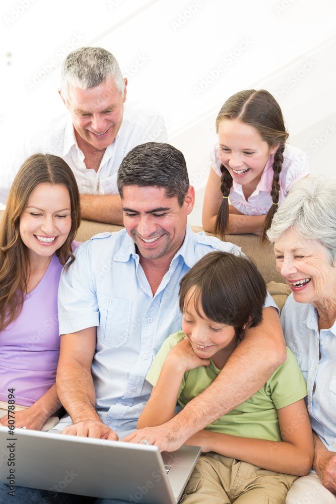 Fototapeta premium Multigeneration family using laptop