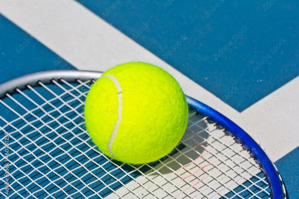 Close up of a tennis ball on racket