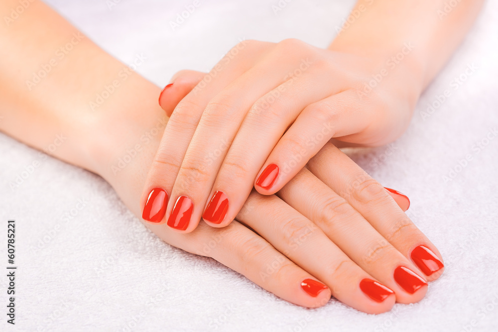 red manicure on the white towel red manicure on the white towel