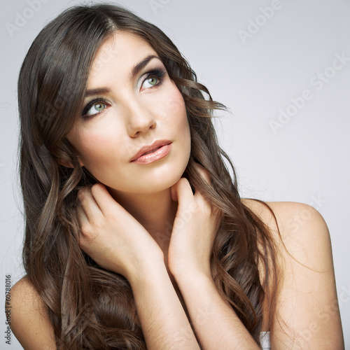 Woman face close up beauty portrait. Girl with long hair lookin
