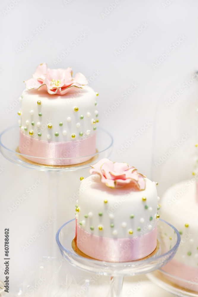 Wedding cakes in cream and pink with pearls. Wedding cakes in cream and pink with pearls.