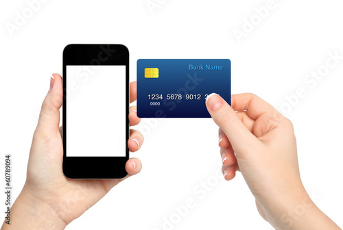 female hands holding phone and credit card on isolated backgroun
