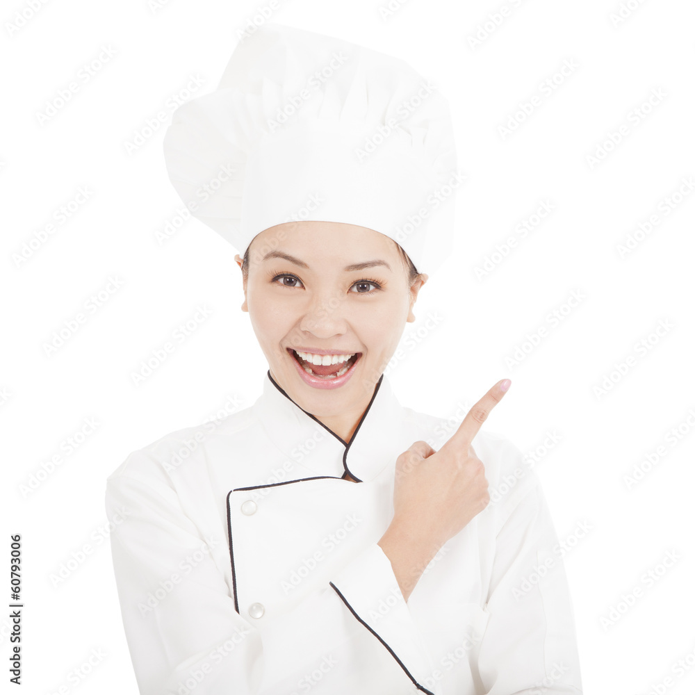 Portrait of young woman chef pointing direction Portrait of young woman chef pointing direction