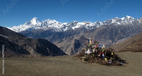 Peaks of Dhaulagiri  and Tuchuche Peak, prayer flags photo