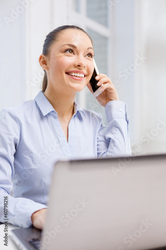 smiling businesswoman with laptop