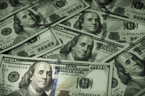 One hundred dollar bills, focus on Benjamin Franklin