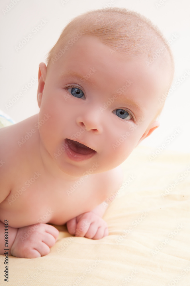Bond little baby blue eyes lying down smiling Bond little baby blue eyes lying down smiling