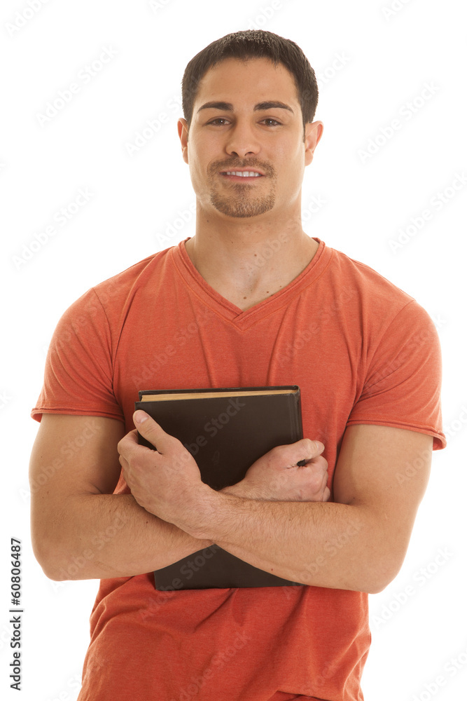 man orange shirt hold book arms man orange shirt hold book arms