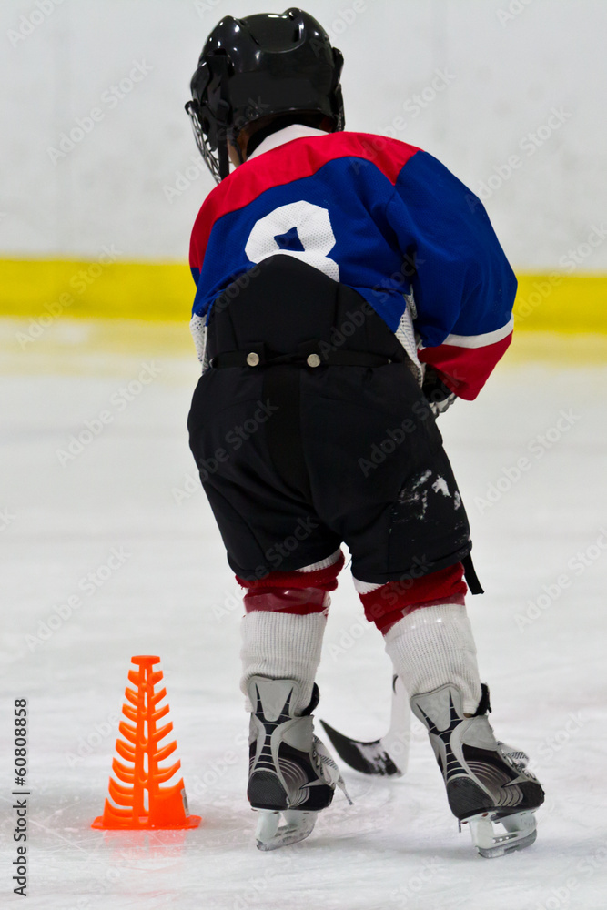 Fototapeta premium Young hockey player at practice