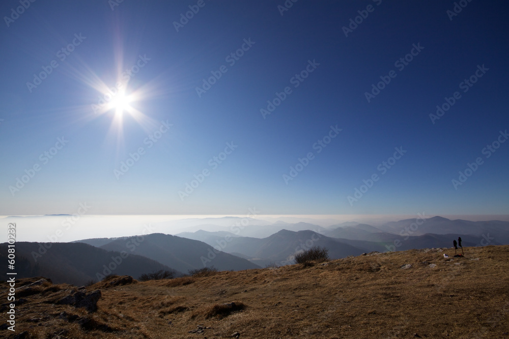 Fototapeta premium Sunny sky above clouds