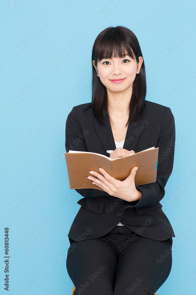 asian businesswoman interviewing on blue background asian businesswoman interviewing on blue background