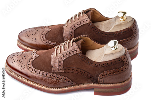 Brogues with shoe trees inserted side view