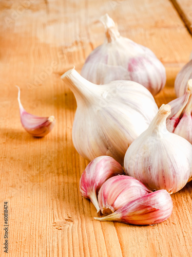 Raw Garlic On Wooden Background