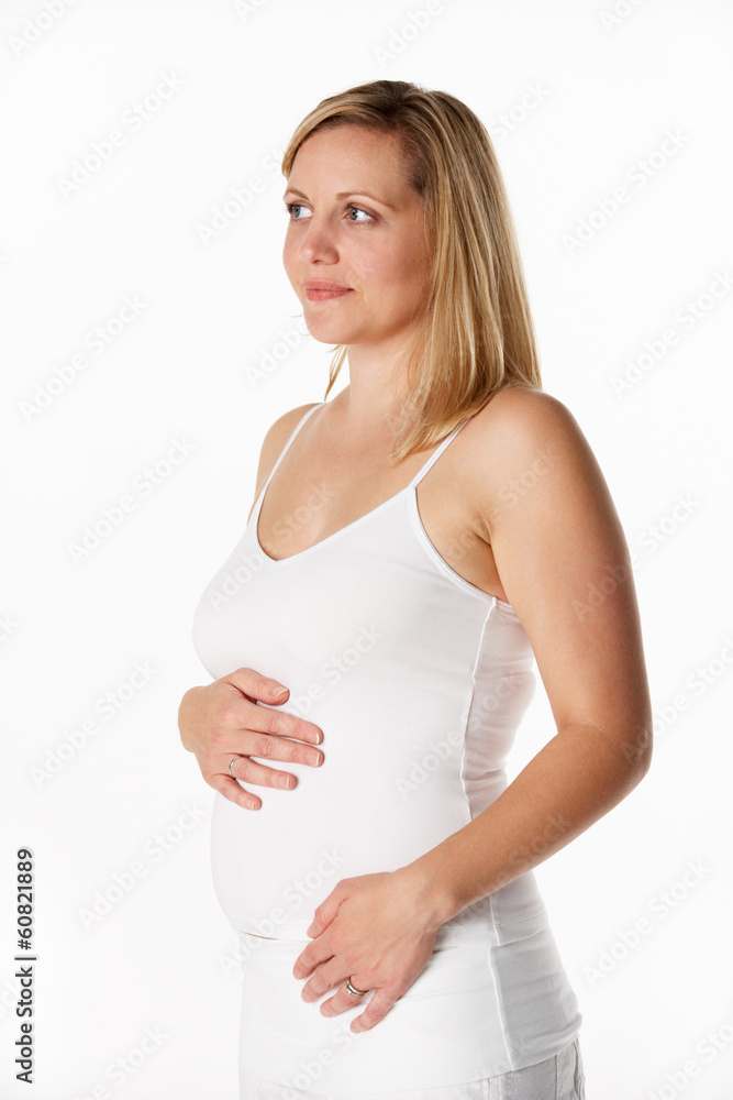 Studio Portrait Of 4 months Pregnant Woman Wearing White Studio Portrait Of 4 months Pregnant Woman Wearing White