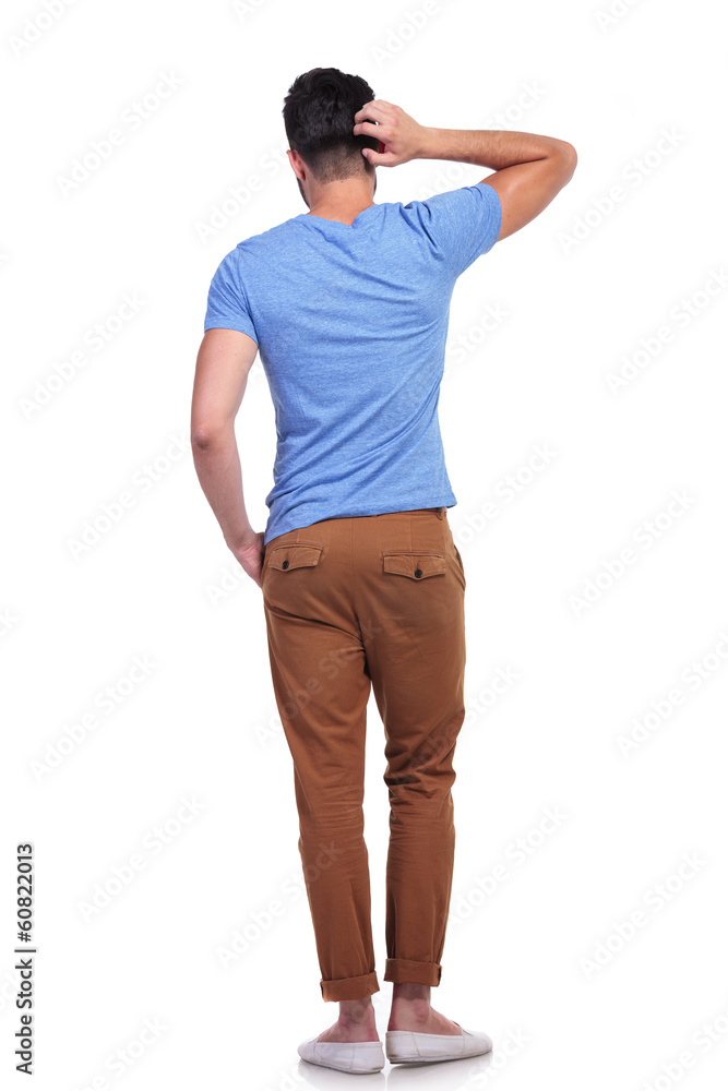 young confused casual man scratching his head young confused casual man scratching his head