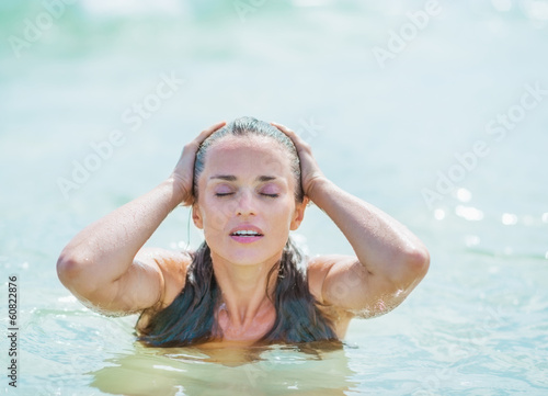 Young woman enjoying sea water