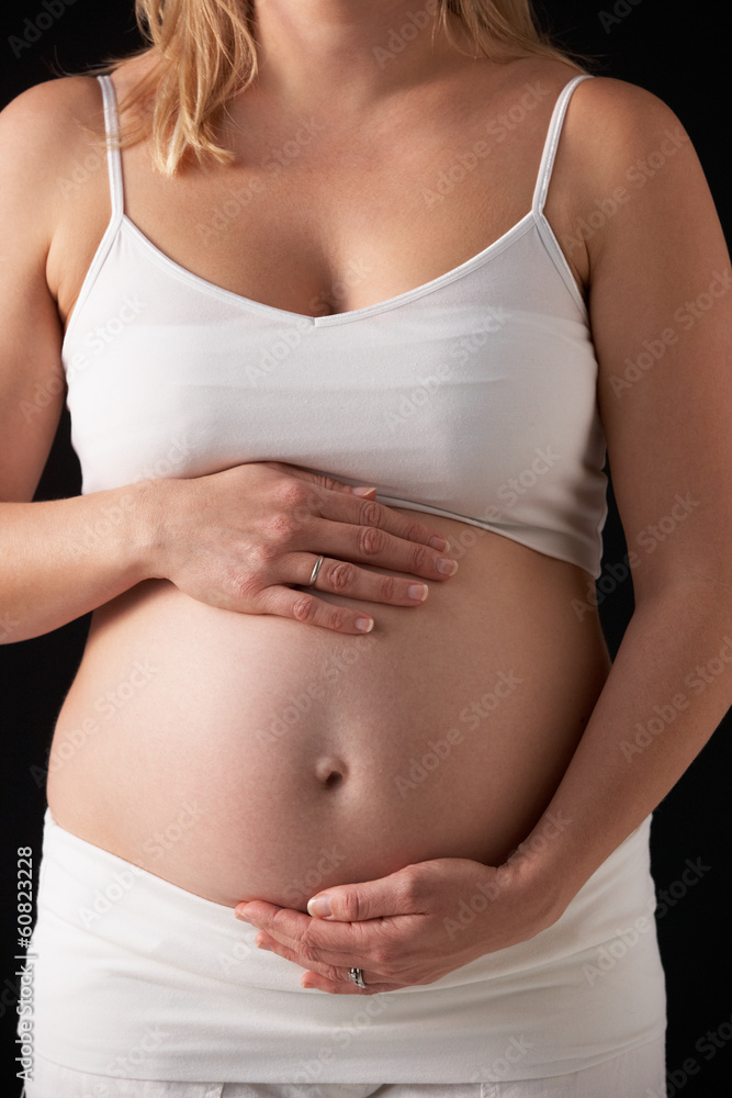 Close Up Portrait Of 5 months Pregnant Woman On Black Background Close Up Portrait Of 5 months Pregnant Woman On Black Background
