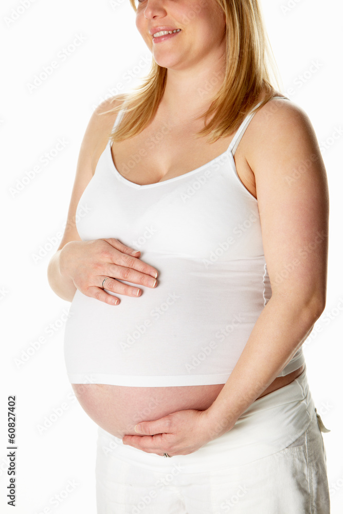 Close Up Studio Portrait Of 8 Months Pregnant Woman Wearing Whit Close Up Studio Portrait Of 8 Months Pregnant Woman Wearing Whit