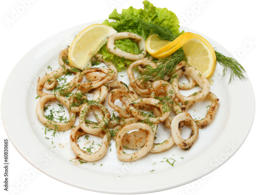 Fish salad with squid rings and testy herbs