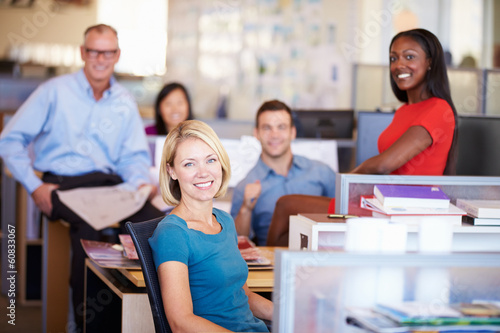 Portrait Of Businesspeople In Modern Open Plan Office