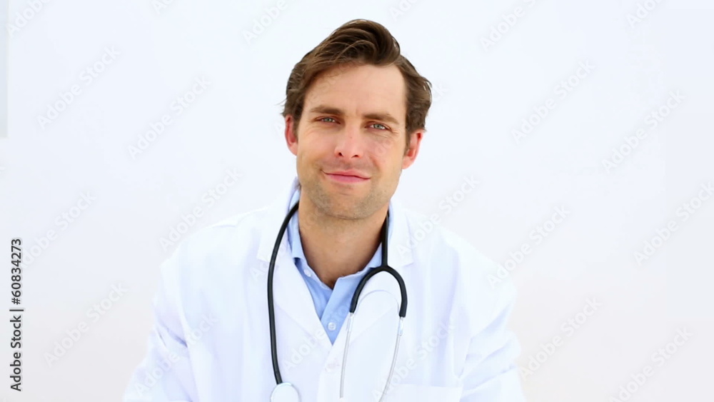 Doctor taking off and putting on stethoscope Doctor taking off and putting on stethoscope