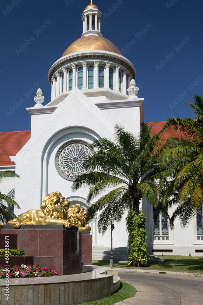 gold lion statue  in front of  church