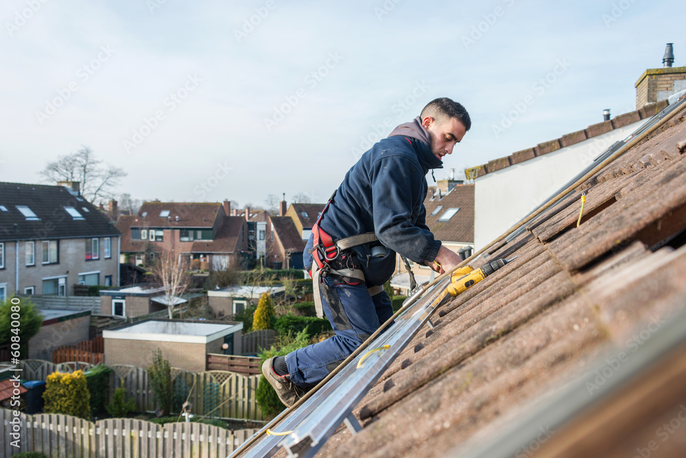 man making the construction for the solar panels