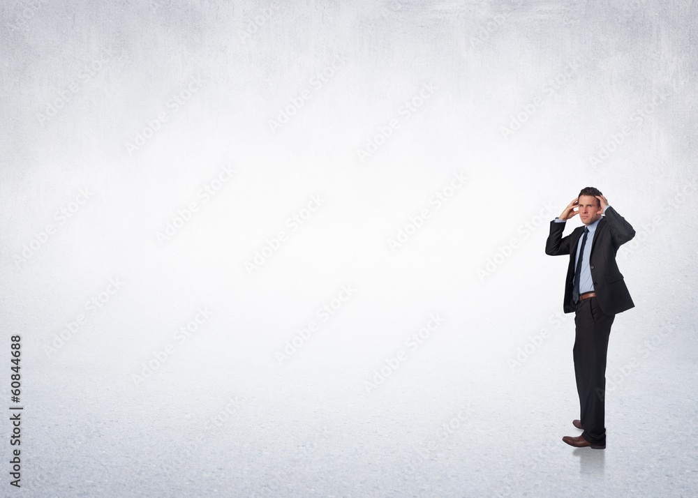 Composite image of stressed businessman with hands on head Composite image of stressed businessman with hands on head