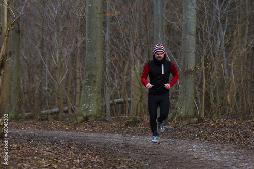 Wallpaper Mural A man running outdoors in a forest Torontodigital.ca