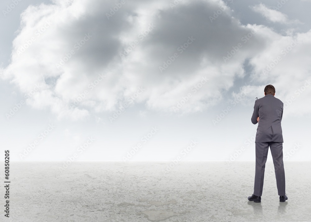 Composite image of thinking businessman holding glasses Composite image of thinking businessman holding glasses