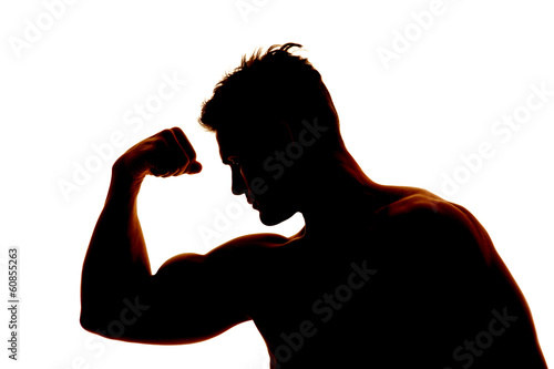 silhouette wet man muscles flex one arm