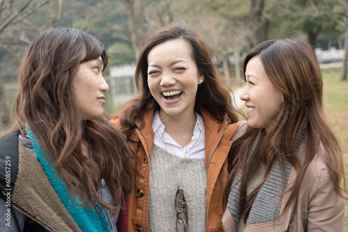 Happy smiling Asian women in the park